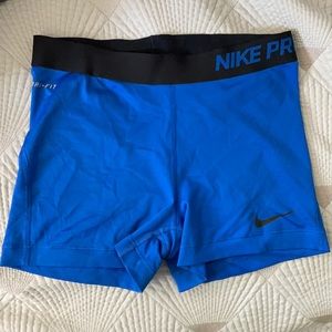 Blue Nike Pro shorts